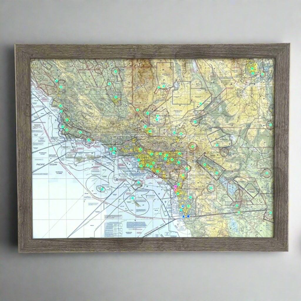 Image of the LightMap Air with driftwood frame mounted on a wall showing live weather and METAR conditions 