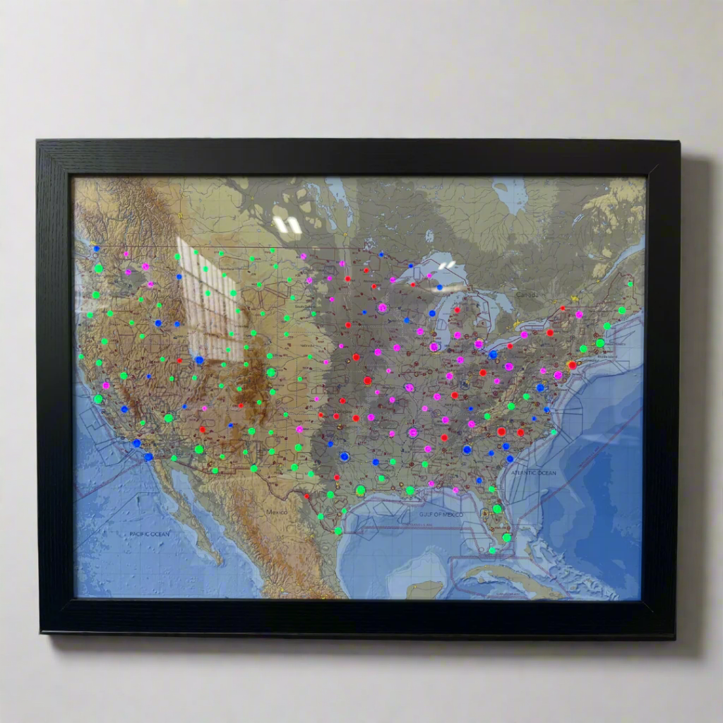 Image of the LightMap AIR USA showing the entire USA with live weather and METAR conditions. The artwork is mounted in a black frame.